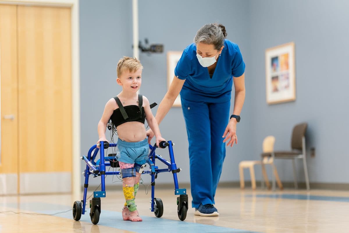 Child with cerebral palsy in therapy