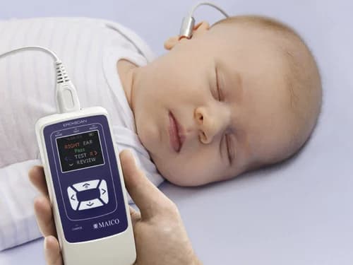 Infant receiving OAE test