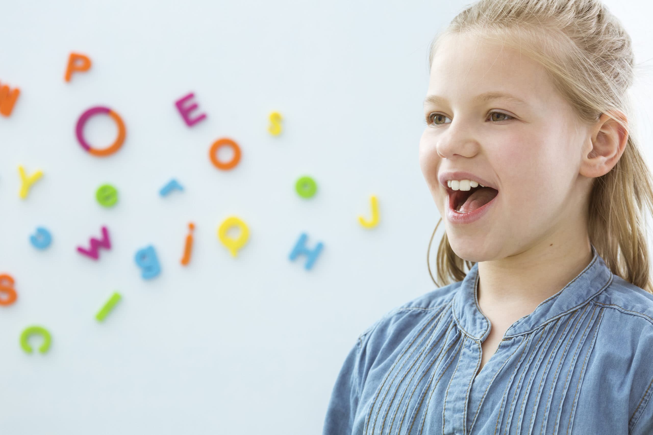Speech therapist assisting with stuttering and cluttering